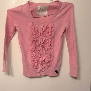 Gorgeous blush pink button up cardigan with riffle detail up front